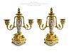 A Pair of Champleve Sevres Figural Bronze Candelabras