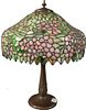 Handel Leaded Glass Table Lamp, having apple blossom shade, marked Handel on bronze base, with two sockets, height 20 1/2 inches, diameter 16 inches.