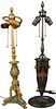 Two Table Lamps, to include a black tole painted two light lamp with lion form mounted handles; along with a green and gilt bronze three light lamp, h