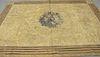 Large Canvas Painted Rug, having a brown floral design to the center, height 7' 1", width 10' 2".