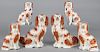 Three pairs of Staffordshire spaniels, 19th c., 9'' h., 9 1/2'' h., and 12 3/4'' h.