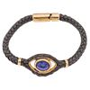 LEATHER BRACELET WITH LAZURITE AND 18K YELLOW GOLD, TANE 1 Lazurite cabochon. Weight: 22.0 g. Length: 7.2" (18.5 cm)