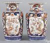 Pair of Japanese Imari palette porcelain urns, 19th c., 15'' h.