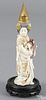 Chinese or Japanese carved and polychrome ivory figure of a woman with drums, ca. 1900, 8'' h.