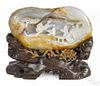 Chinese carved celadon and russet jade mountain, with stand - 7'' x 8''.