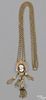 Victorian yellow gold slide chain with four tassels and a shell cameo, 36.3. dwt