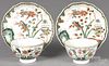 Chinese Kangxi period pair of famille verte cups and saucers with flower decoration.