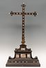 Reliquary cross; Italy, 17th century. Ebony, chiseled bronze mounts, gouache on vellum and carved bone.
