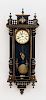 ENGLISH RENAISSANCE REVIVAL MOTHER-OF-PEARL INLAID AND PAINTED EBONIZED WALL CLOCK