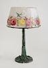 AMERICAN ART NOUVEAU PUFFY AND INTERIOR PAINTED GLASS SHADE AND VERDIGRIS PATINATED METAL TABLE LAMP