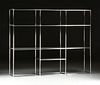 A CONTEMPORARY THREE SECTION CHROMED STEEL BOOK DISPLAY SHELVING UNIT, BY ABSTRACTA,