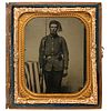 [CIVIL WAR]. Sixth plate tintype of armed Zouave posed beside American flag. N.p.: n.p., [1860s].