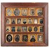 [EARLY PHOTOGRAPHY]. Daguerreian wall frame containing 24 daguerreotypes, ambrotypes, and tintypes, incl. Civil War soldiers and African American woma