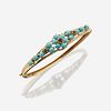 A fourteen karat gold, turquoise, and sapphire bangle
