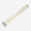 A cultured pearl, diamond, and fourteen karat white gold bracelet
