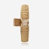 A fourteen karat gold, covered dial bracelet wristwatch