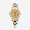 A gold, stainless steel, and diamond, automatic, bracelet wristwatch with date