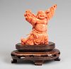 Smiling Buddha. China, 20th century.
Coral.
Carved wooden base.
Weight: 478 gr (with base).