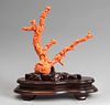 Set of three coral branches with an standing beauty, a group of rabbits and a set of children. China, 20th century.
Coral.
Wooden base.