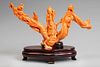 Guanyin with dragon. China, 20th century.
Coral.
Wooden base.