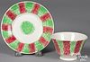 Green and red rainbow spatter cup and saucer,
