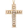 CROSS WITH DIAMONDS IN 10K YELLOW AND WHITE GOLD AND PALLADIUM SILVER Brilliant cut diamonds ~0.40 ct. Weight: 3.7 g
