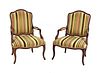 A pair of French Louis XV beech fauteuils,
