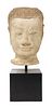 A carved stone head of Buddha,