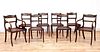 A set of eight simulated rosewood dining chairs,