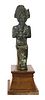 An Egyptian bronze and clay figurine of Osiris,