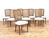A set of eight modern bleached oak dining chairs,
