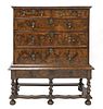 A William and Mary walnut and feather-banded chest on stand,