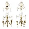 A pair of Continental polished brass and cut-glass wall lights with lustres