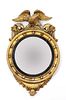 A Regency period circular gilt eagle wall mirror,