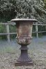 A large cast iron garden urn,