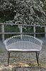 A Victorian wirework double garden seat,