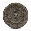 A Chinese Bronze Circular 'Mythical Beasts and Grapes' Mirror