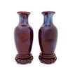 PAIR, CHINESE SANG DE BOEUF FLAMBE VASES ON STANDS
