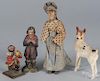 Four carved wooden figures, to include a folk art doll of an old woman, 6 3/4'' h.
