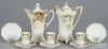 Two R. S. Prussia porcelain chocolate pots, ca. 1900, 9'' h. and 9 1/2'' h., together with three cups