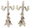 Pair of German Porcelain Candelabras, mounted with orange and pink flowers and two puttis each, marked to the underside "Made in Germany, 1817", heigh