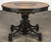 Aesthetic style burl veneer and ebonized center table, mid 20th c., with a marquetry inlaid top