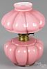 Miniature pink melon rib oil lamp, ca. 1900, 7'' h.