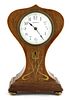 An Art Nouveau mahogany boxwood and brass-inlaid mantel clock,
