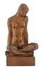 A carved wood sculpture of a nude,