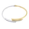 An 18ct gold diamond crossover bangle. Of asymmetric design, the square-shape diamond lines, to the
