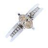A diamond dress ring. The marquise-shape diamond, to the brilliant-cut diamond line shoulders and an