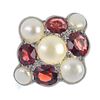 A freshwater cultured pearl and garnet cluster ring. The freshwater cultured pearl and oval-shape ga