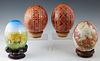 Group of Four Ostrich Eggs, 20th c., two of Ukrainian Easter Style; with bright geometric decoration; one with a hand painted tiger in a landscape; an