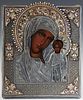Russian Icon of the Virgin of Kazan, late 19th c., with a silverplated and enamel oklad, unmarked, on a gold velvet covered back plate, H.- 12 7/8 in.